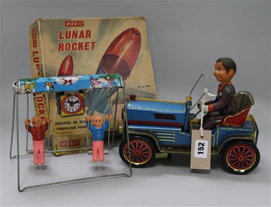 A tin plate car and driver toy, a Merit Lunar rocket boxed, and another plate toy